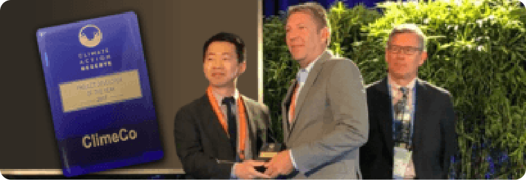 ClimeCo COO shaking hands with a presenter and receiving the CAR award.
