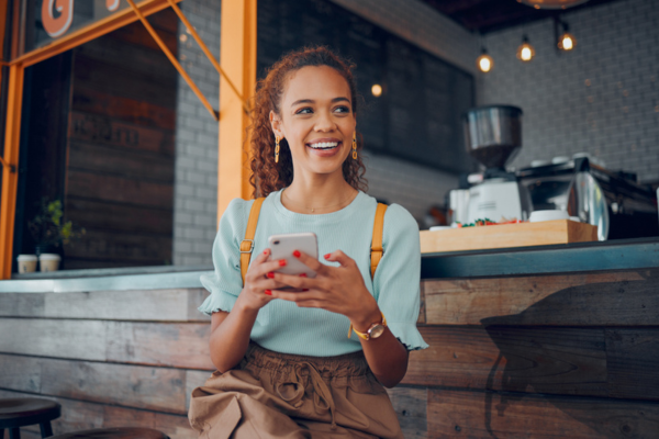Woman smiling on cell phone