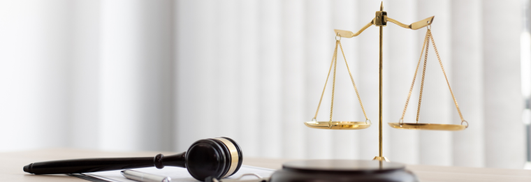 gavel and scale on a desk