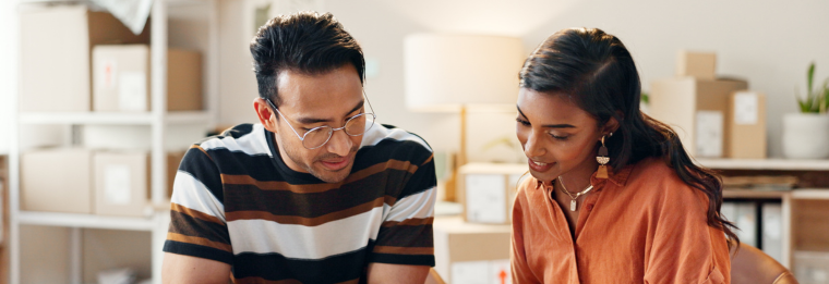 Man and woman sitting at desk